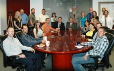 Group Photo of Adobe Associates Staff in Conference Room