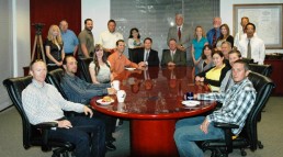 Group Photo of Adobe Associates Staff in Conference Room