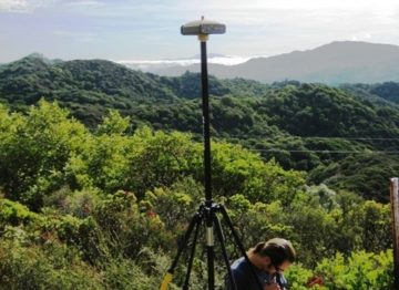 Land Surveying - Surveyor taking notes in the field