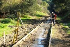 Surveyor on Sonoma-Marin Area Rail Transit Track