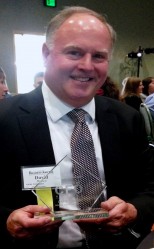 David Brown holding 'Leading CFO" Award