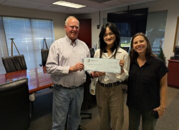 David Brown and Casey Talbot, Adobe Associate principals, present 2026 scholarship check