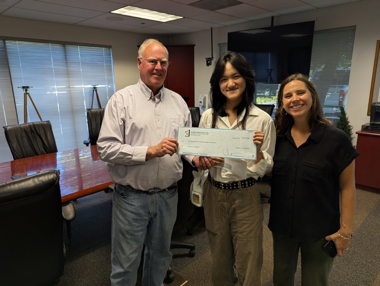 David Brown and Casey Talbot, Adobe Associate principals, present 2026 scholarship check